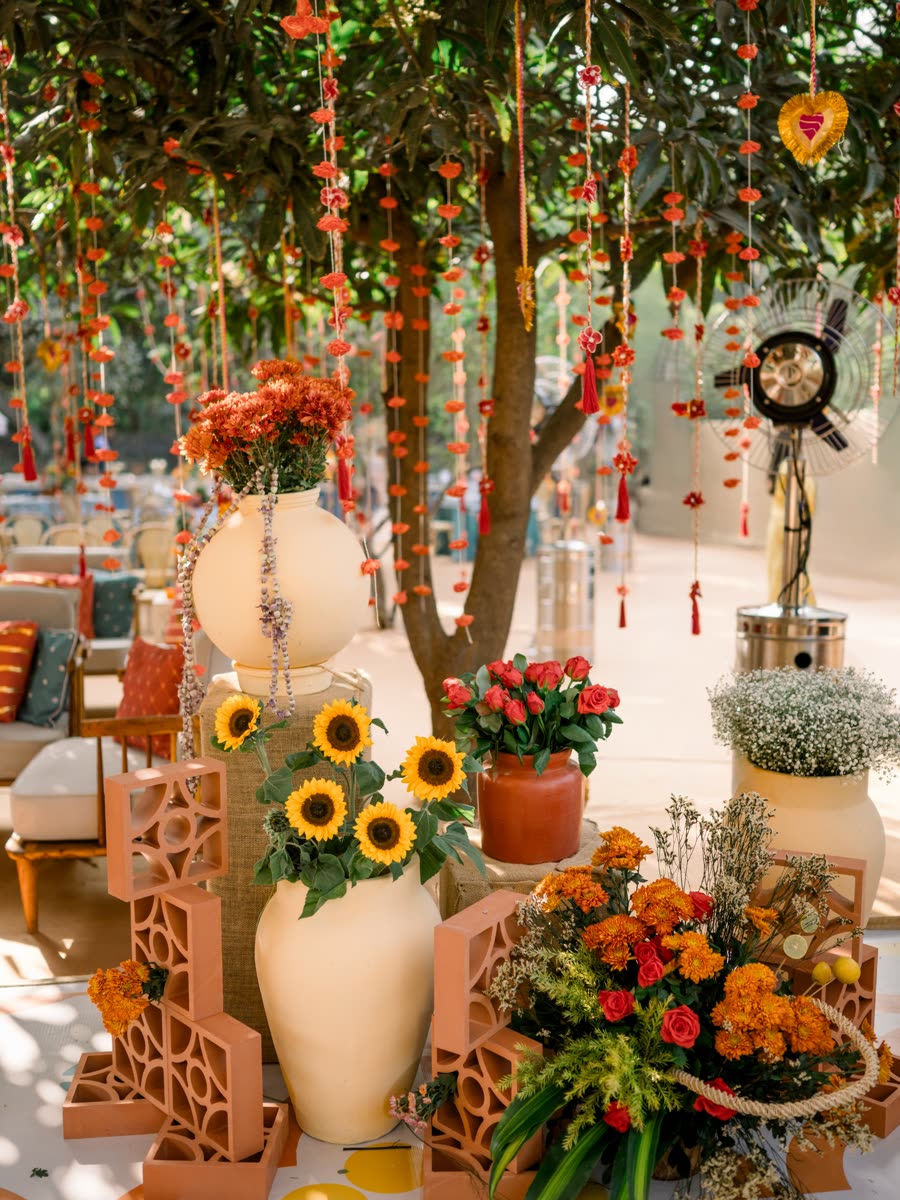Marigolds and sunflowers under a canopy of hanging florals