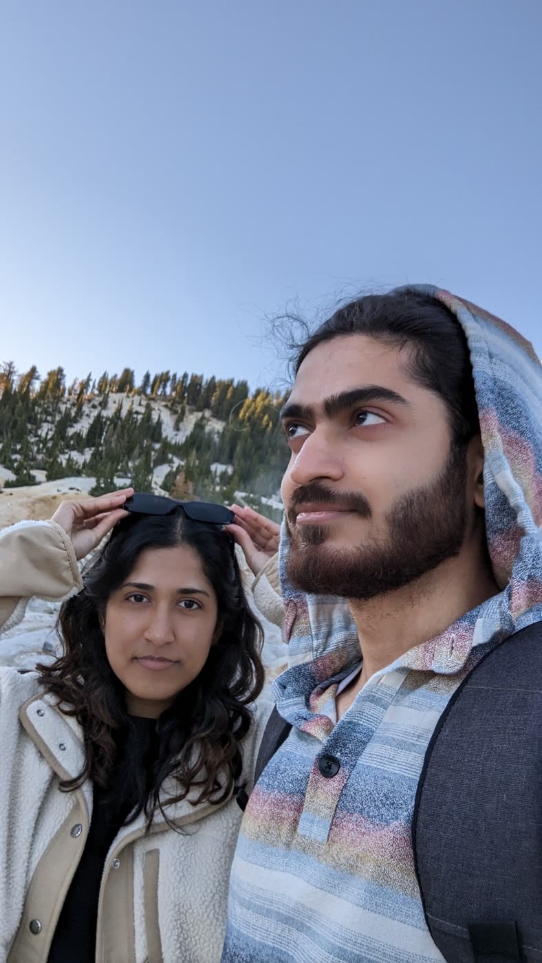 Abirami and Prateek among snow-covered pines