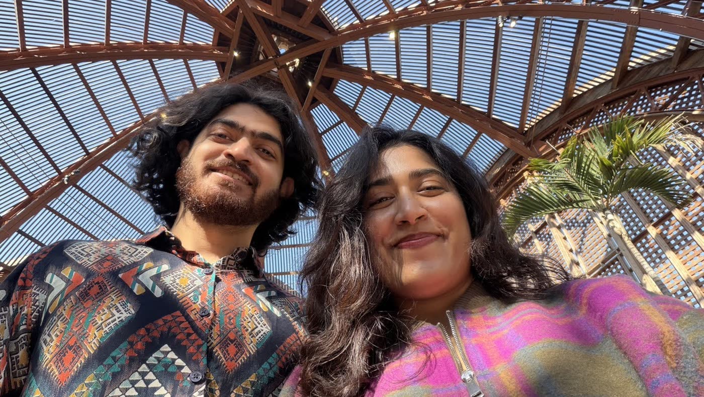 Abirami and Prateek beneath a glass dome